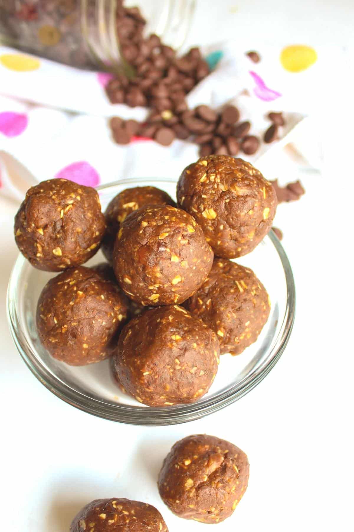 Date balls in a small glass serving bowl