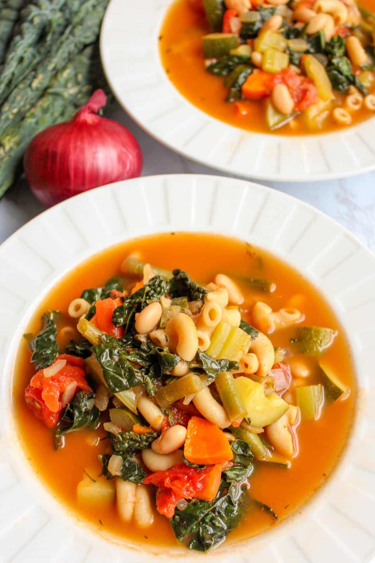 Vegan minestrone soup in a white bowl.