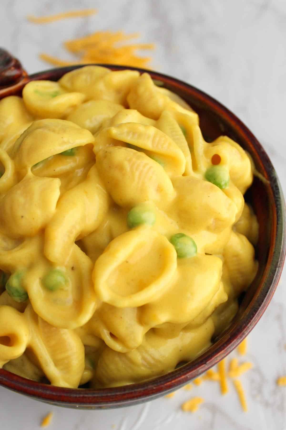 Dairy free mac and cheese in a brown bowl