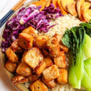 Tofu buddha bowl filled with tofu, rice and vegetables