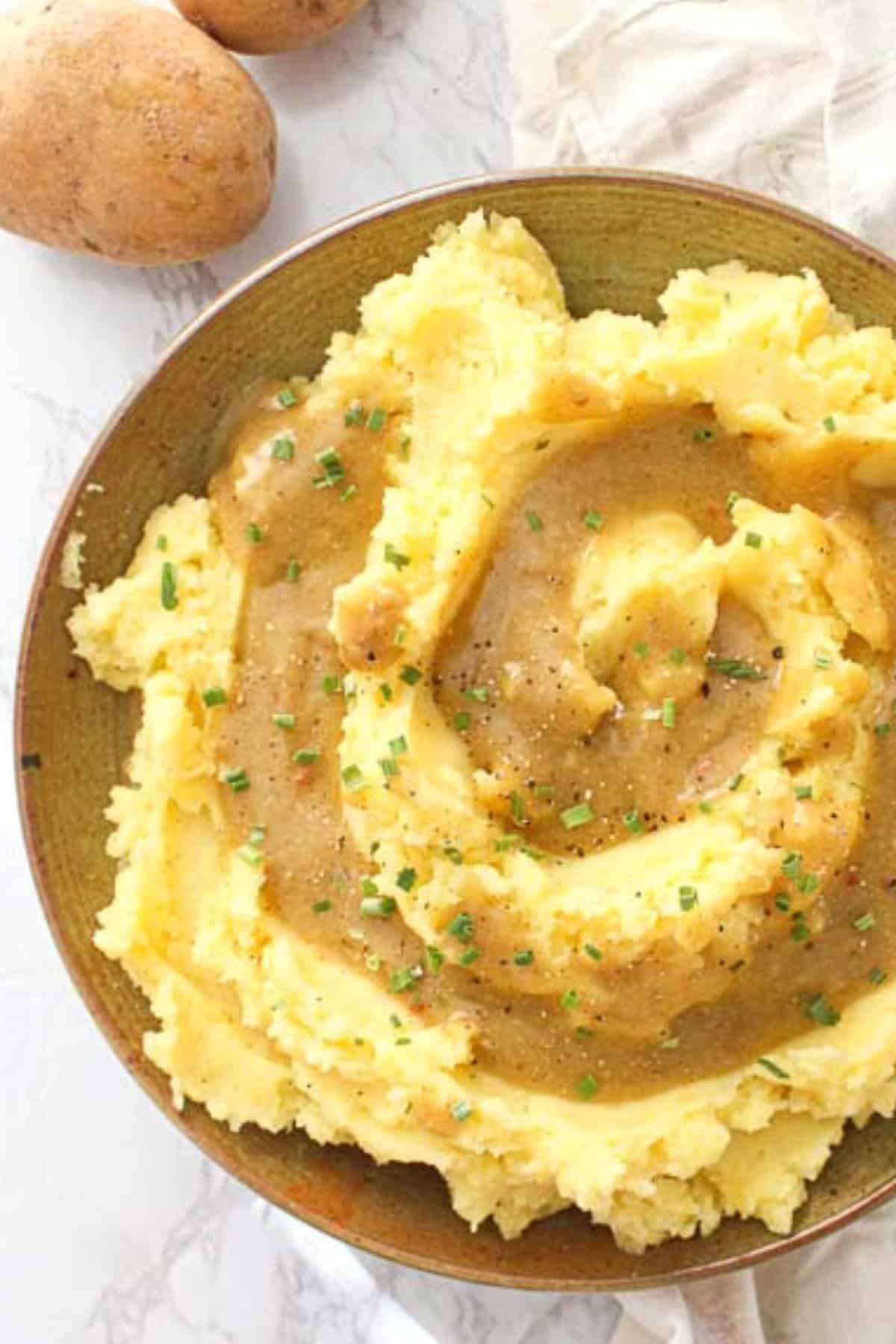Overhead view of vegan brown gravy on mashed potatoes.