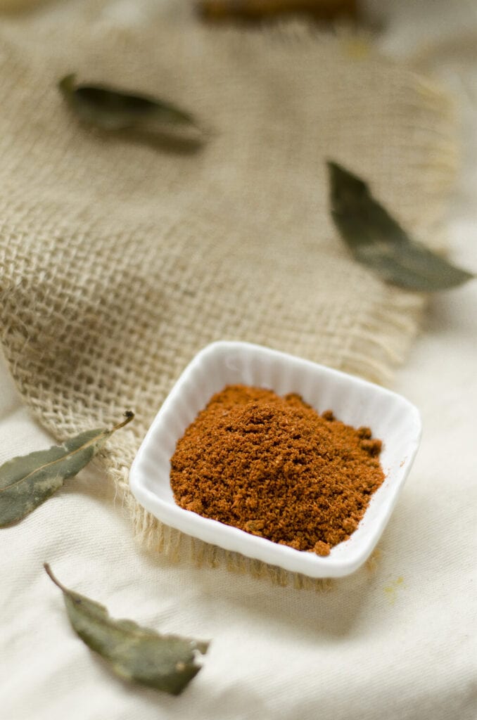 Garam masala spice in a small white bowl