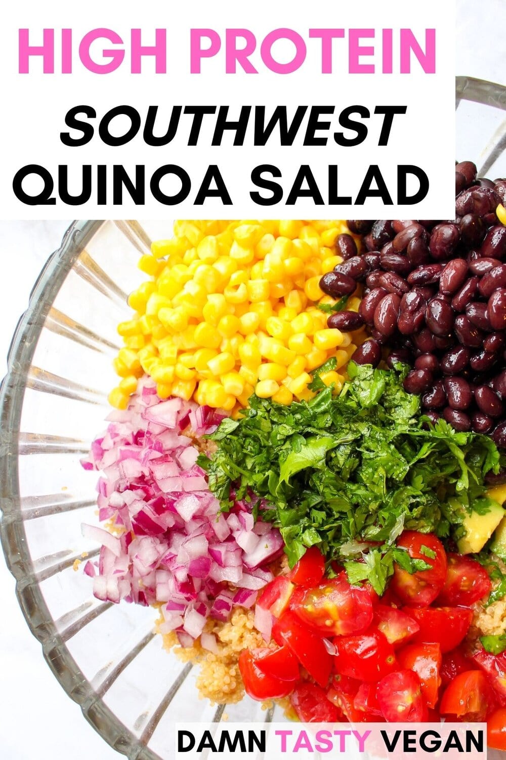 Quinoa black bean salad in a glass serving bowl.