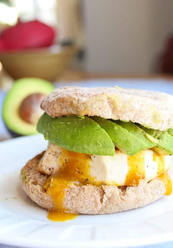 Vegan fried egg sandwich with avocado.
