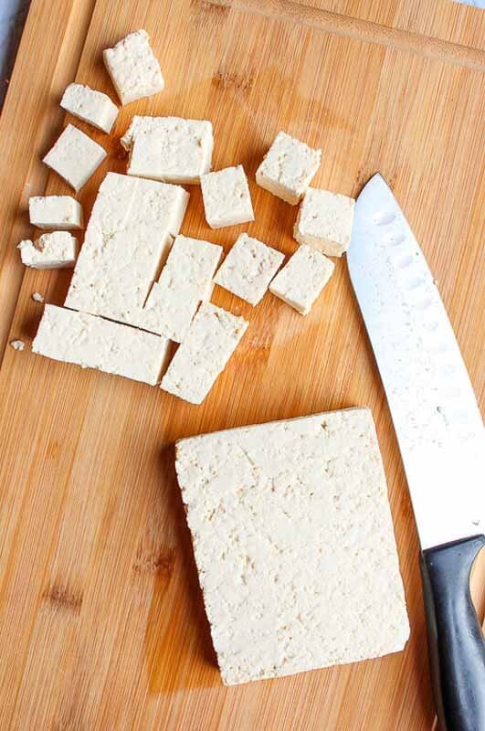 block of tofu on a cutting board