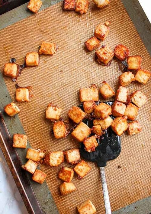 Sesame ginger baked tofu on a baking sheet