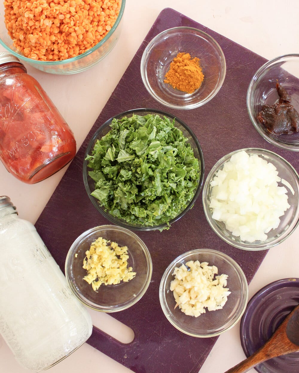 Ingredients for instant pot red lentil dal on a table.