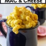 Vegan mac and cheese in a mug with text overlay for pinterest