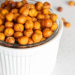 close up of crispy chickpeas in a small white bowl.