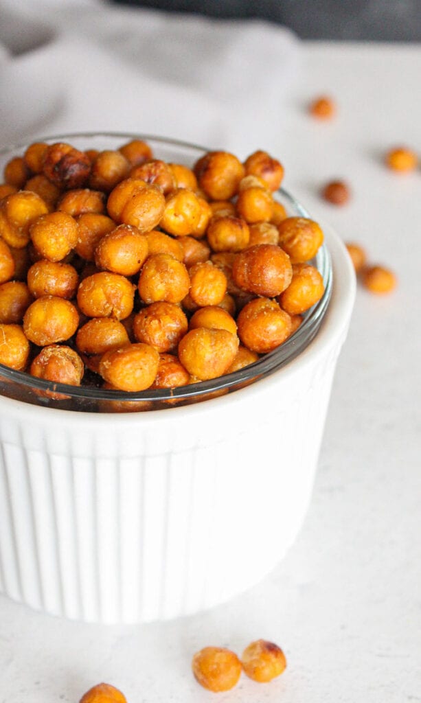 Crispy chickpeas in a small white bowl - close up. 