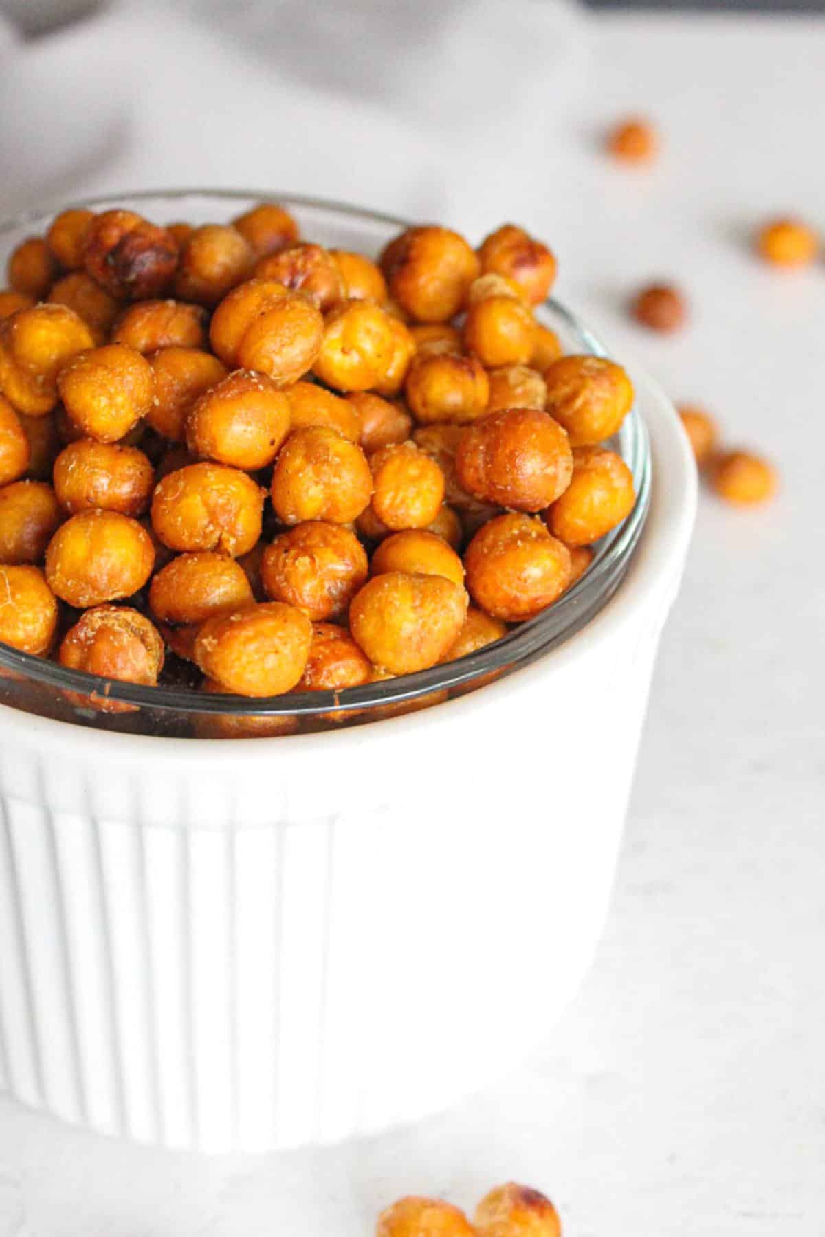 Small bowl filled with crispy roasted chickpeas.