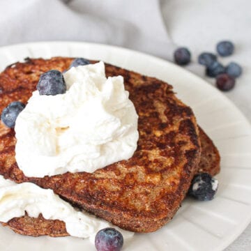 Vegan french toast with whipped cream and blueberries