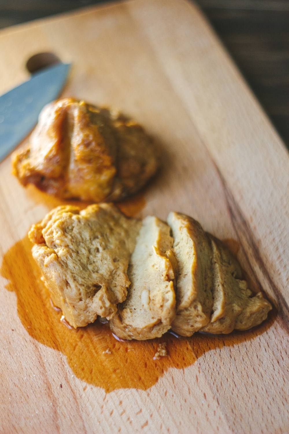 Seitan on a cutting board sliced