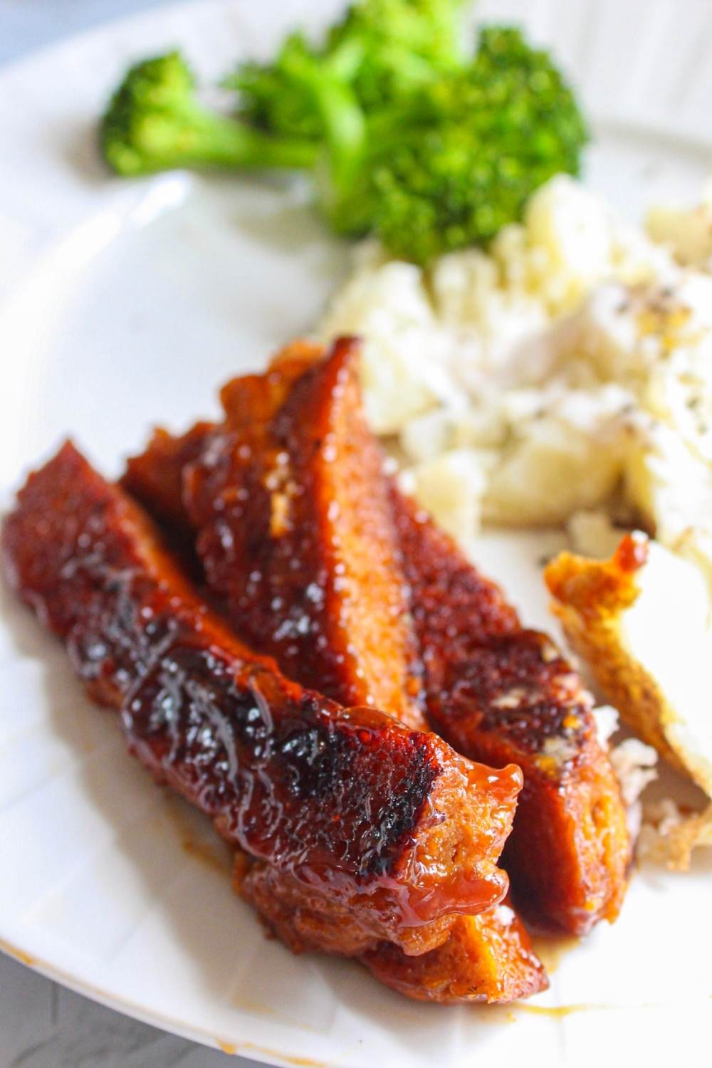 Seitan bbq ribs on a plate with potatoes