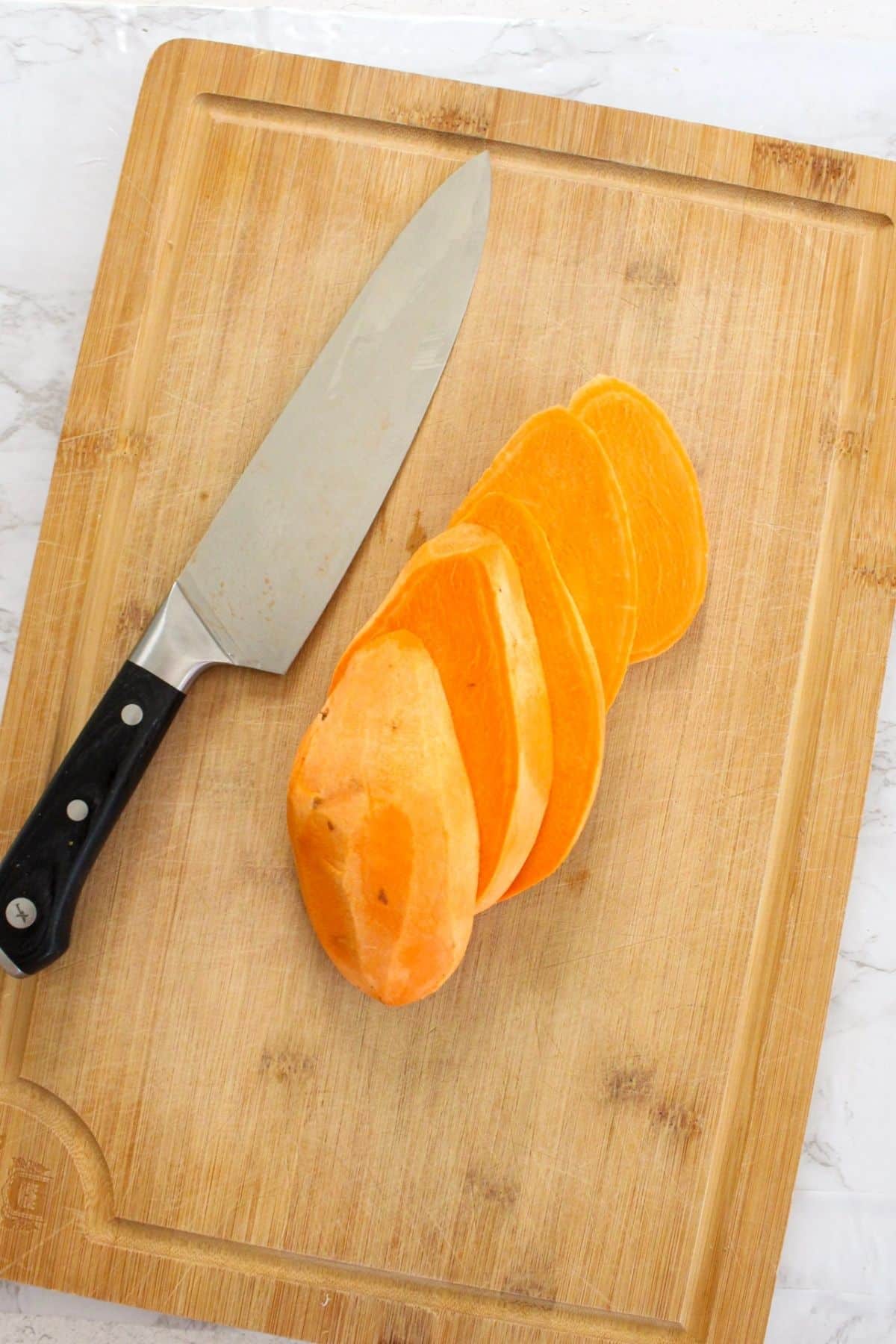 Peeled sweet potatoes cut into strips