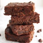 Four vegan black bean brownies stacked on top of each other
