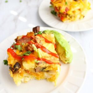 Two pieces of vegan breakfast casserole on two plates