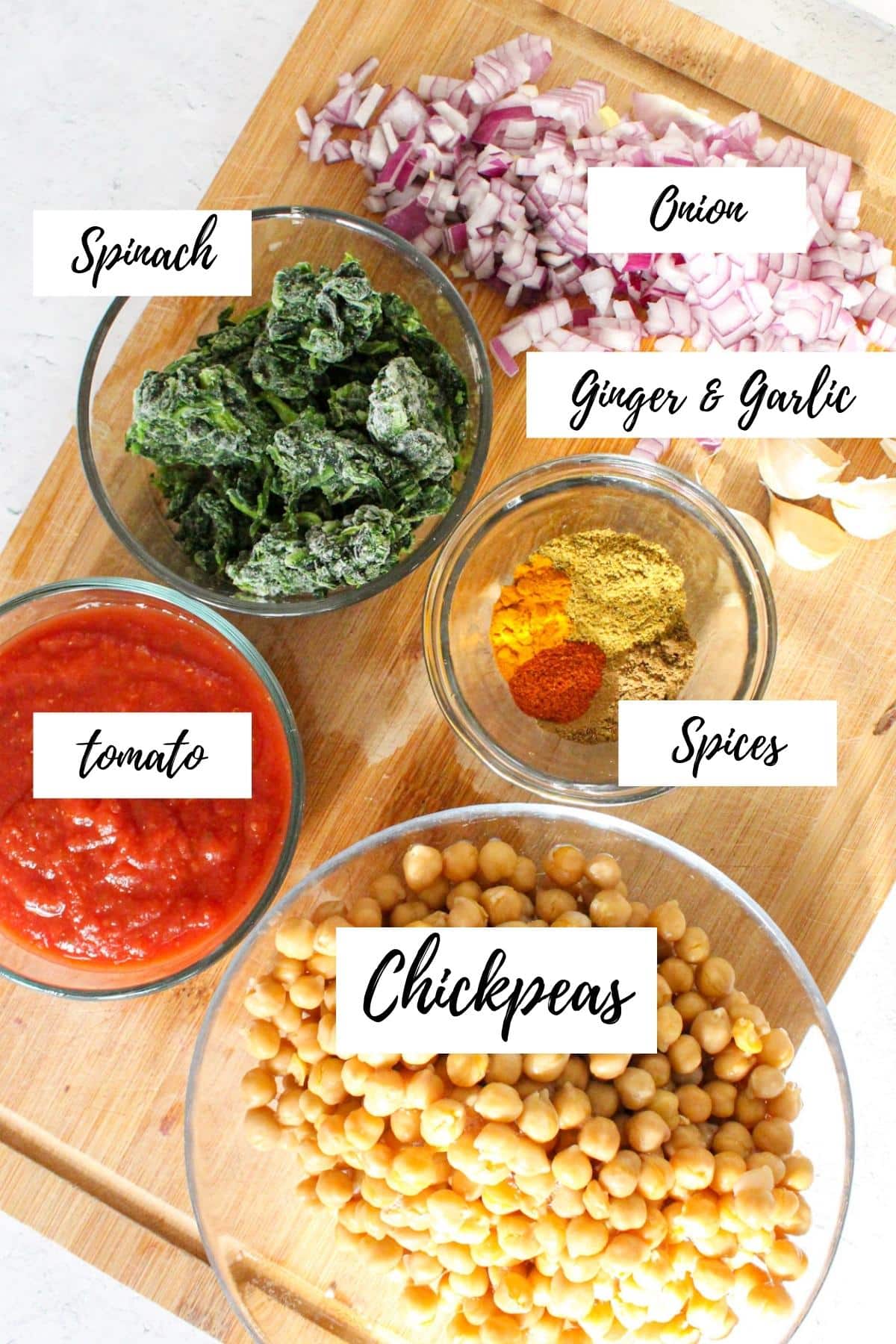 Ingredients of spinach and chickpea curry laid out