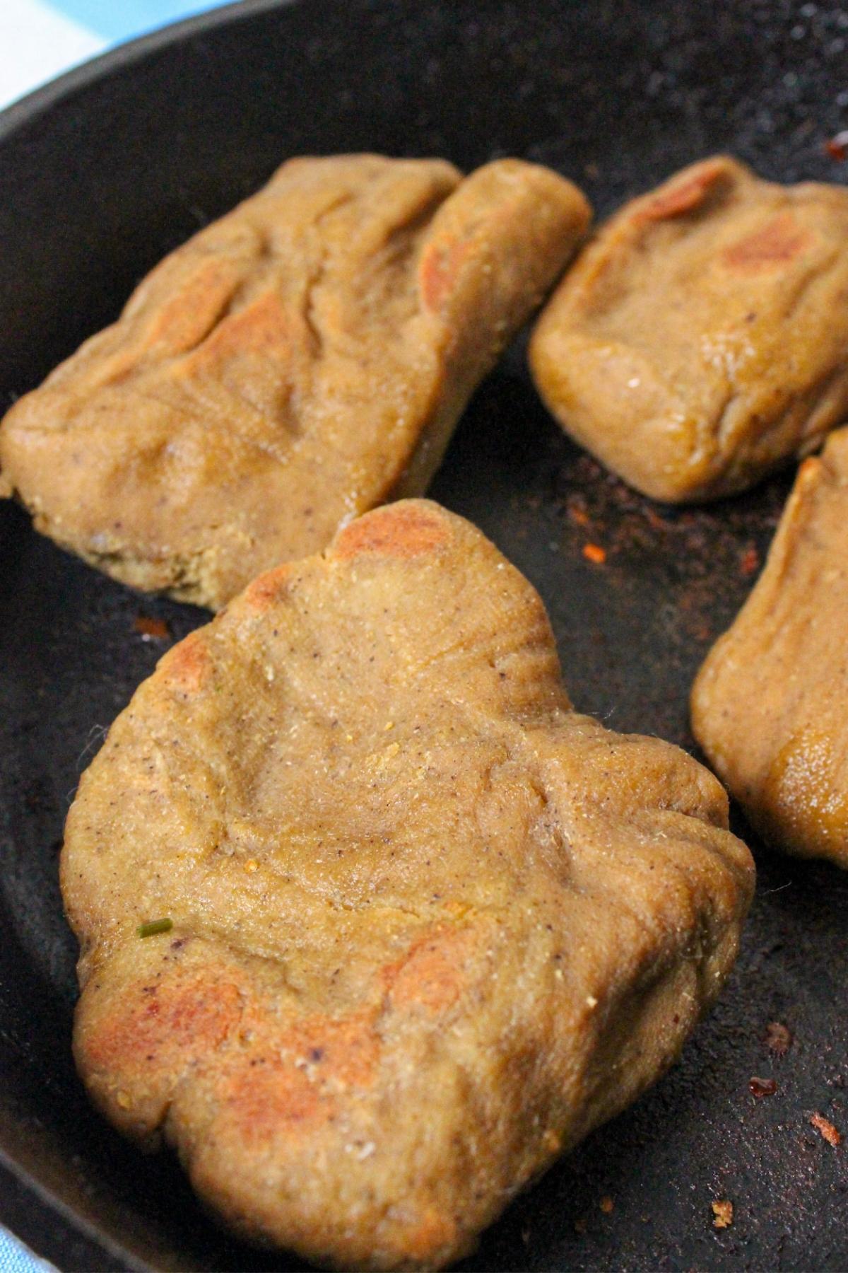 Vegan chicken breast in a cast iron pan