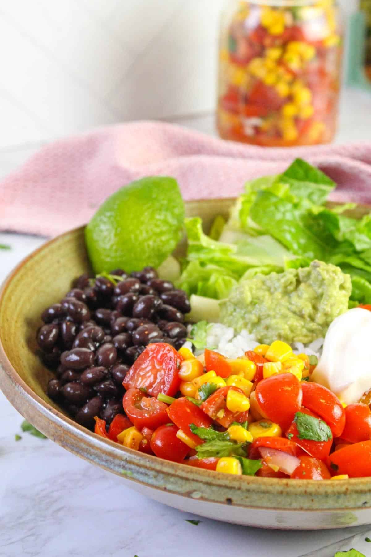 Close up of vegan burrito bowl on a table