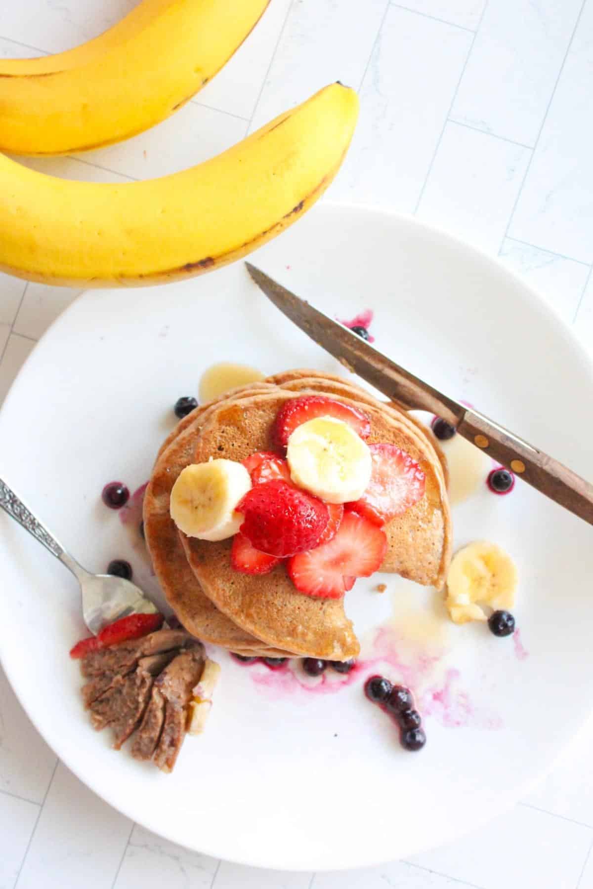 Top view of banana protein pancakes on a plate