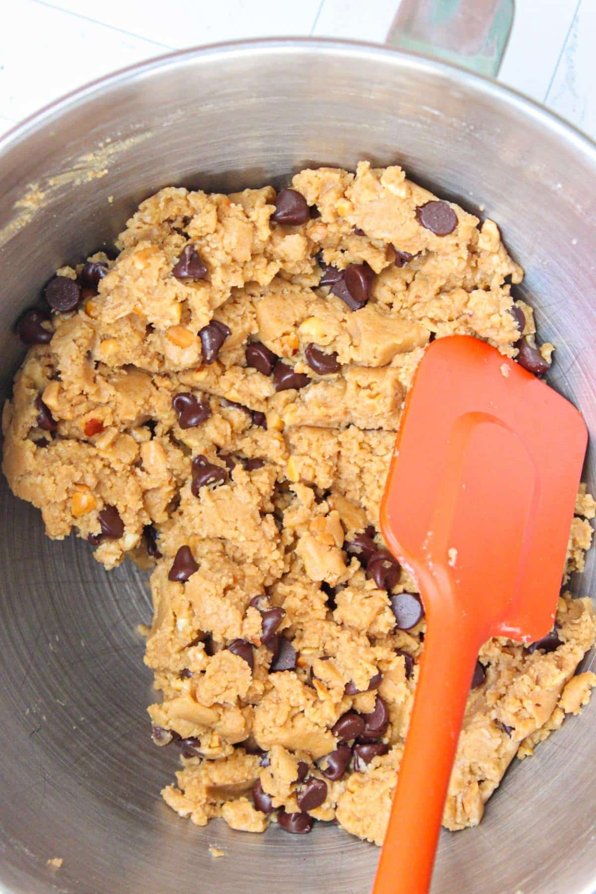 Mixing bowl filled with peanut butter chocolate chip cookie dough