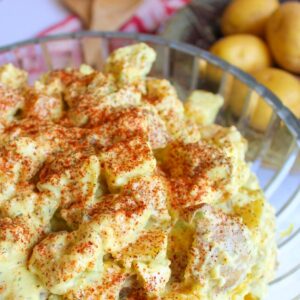 Vegan potato salad in a large glass bowl.