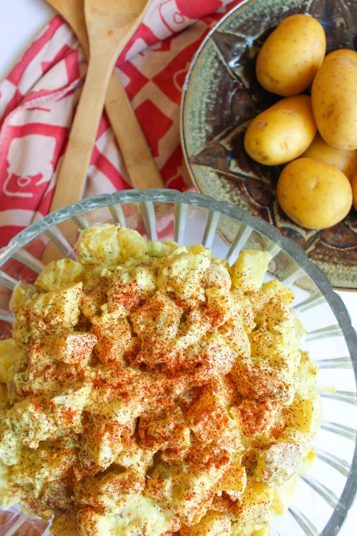 Vegan potato salad in a large glass bowl.