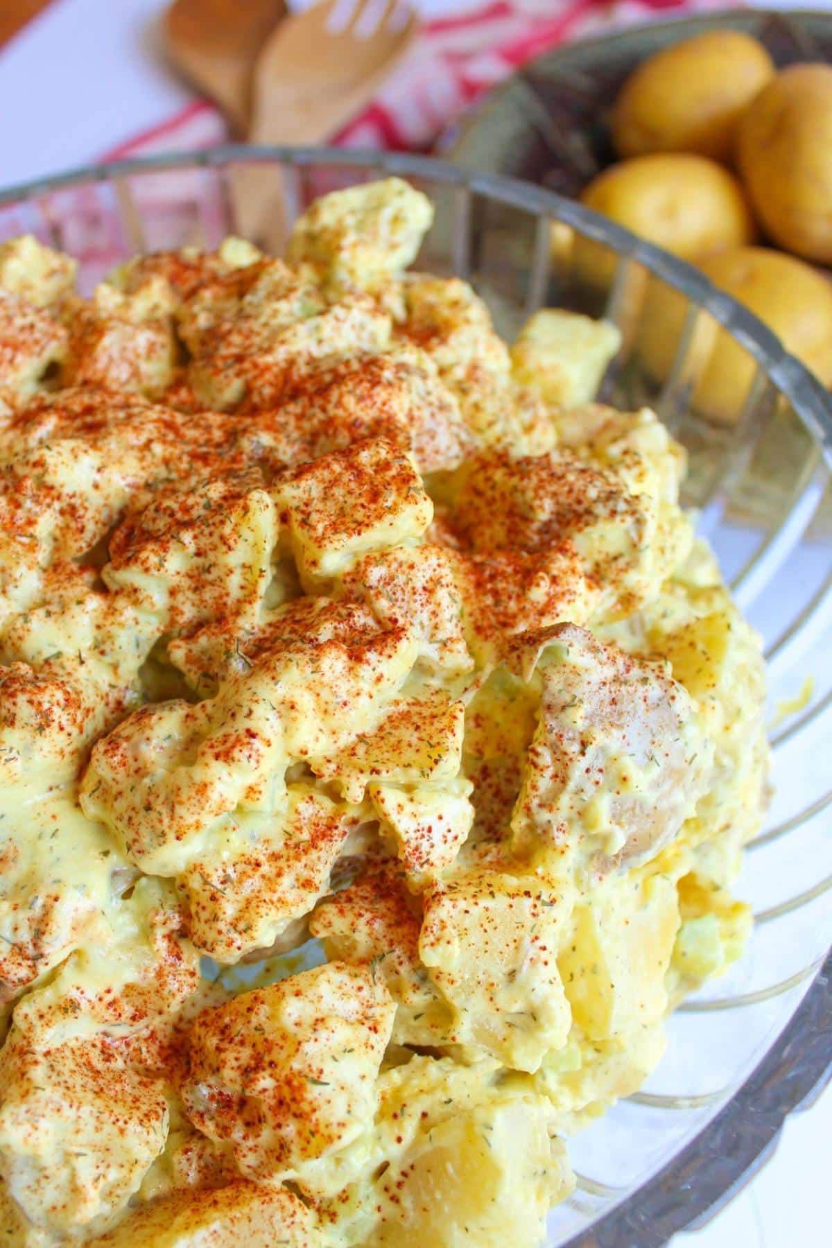 Vegan potato salad in a large glass bowl.