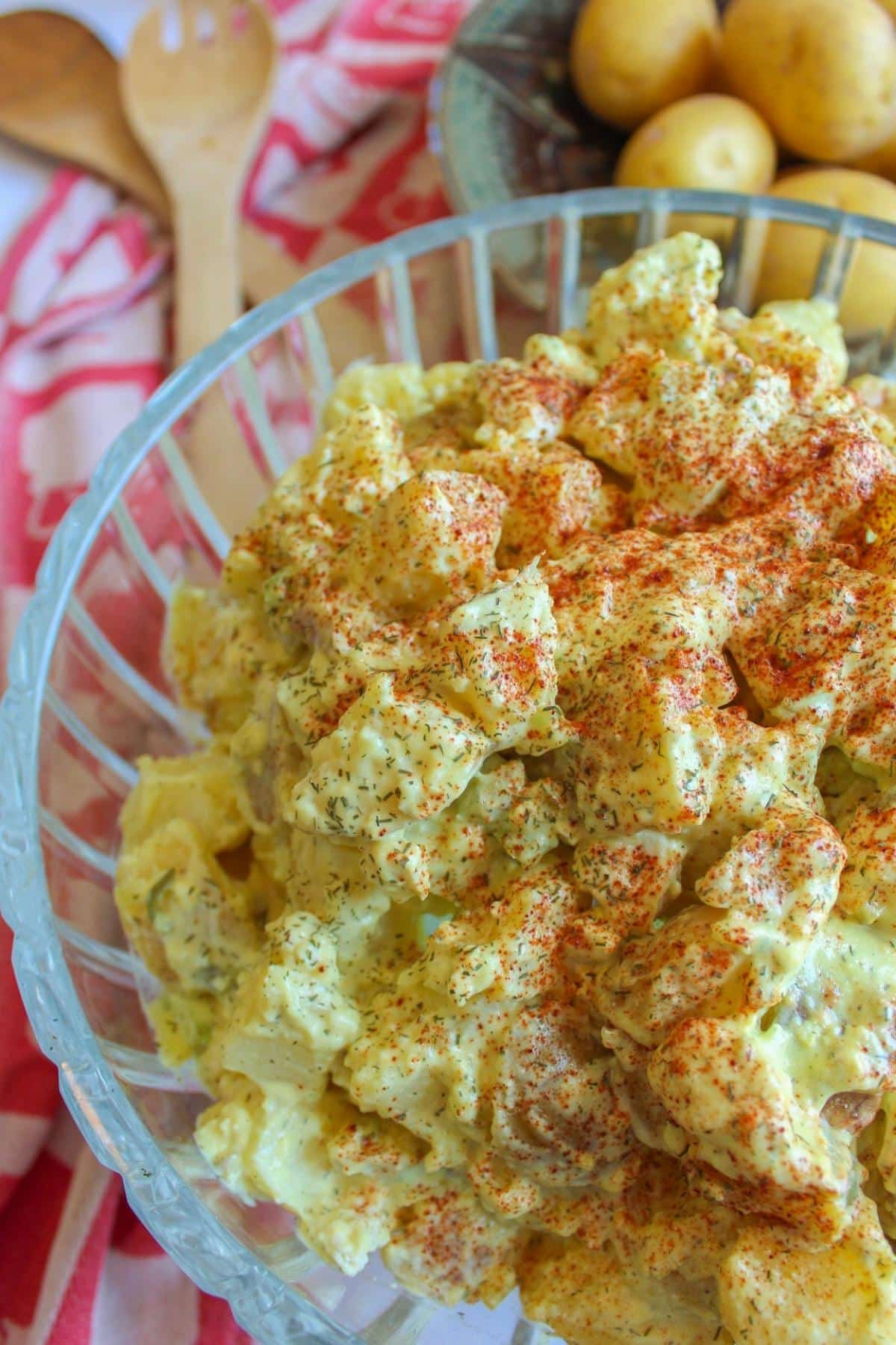 Vegan potato salad in a large glass bowl.