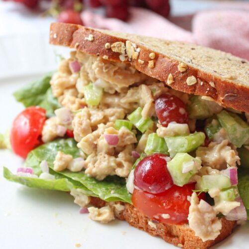 Vegan chicken salad sandwich on a plate.