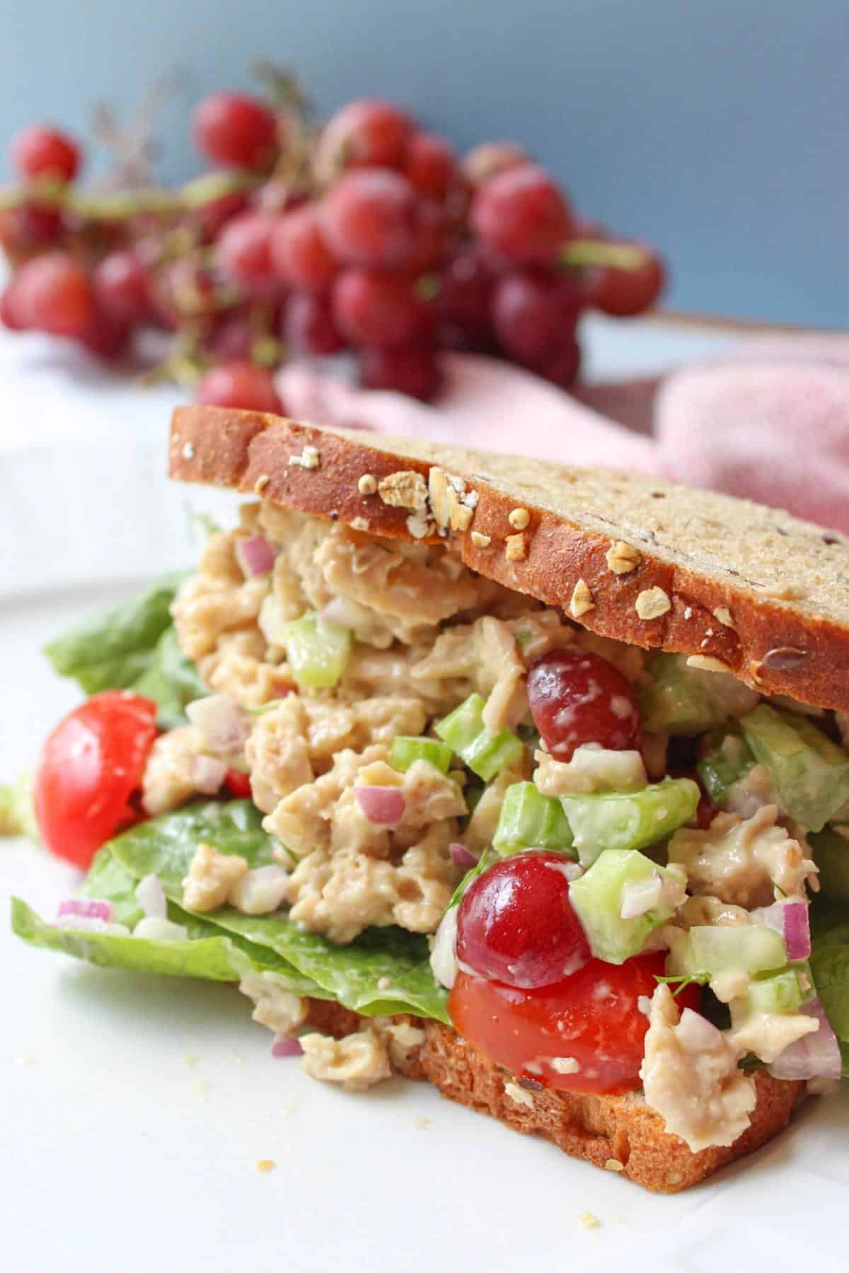 Vegan chicken salad sandwich on a plate.