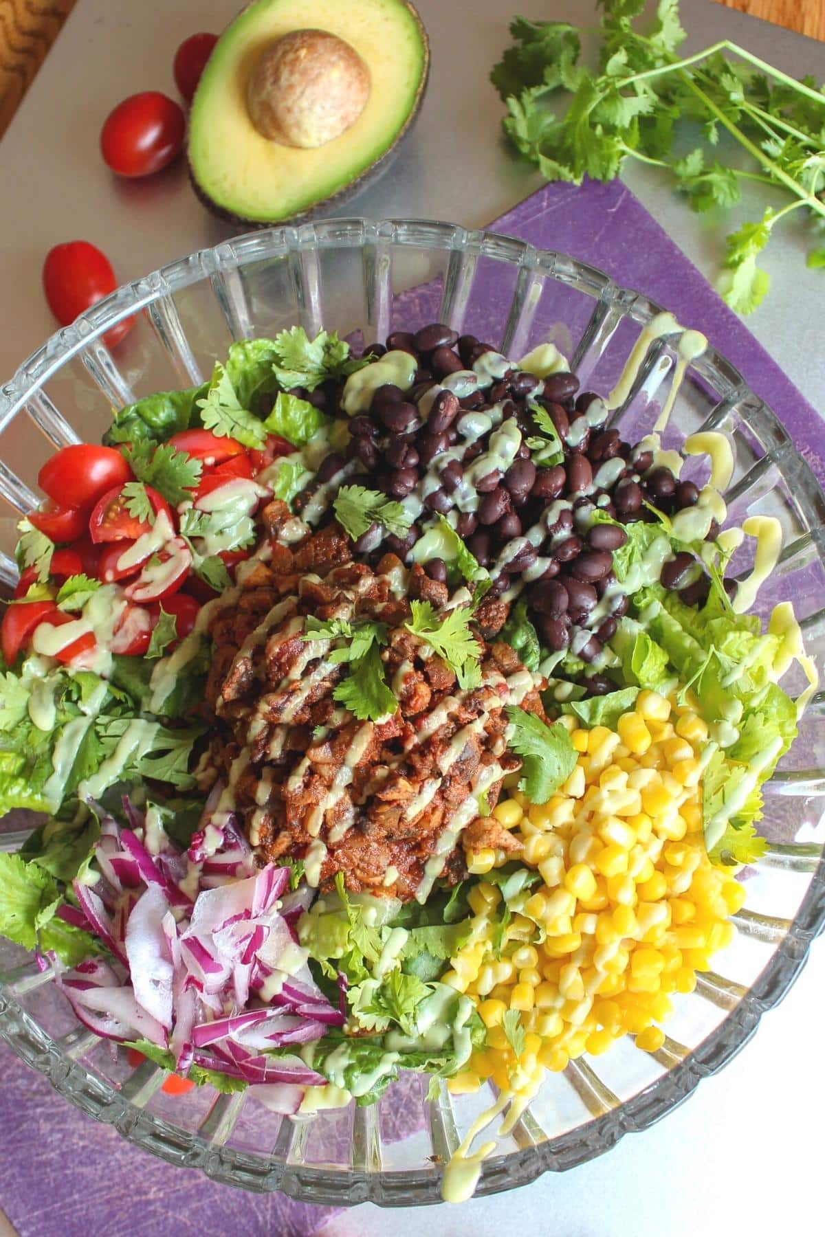 Vegan taco salad in a large glass serving bowl.