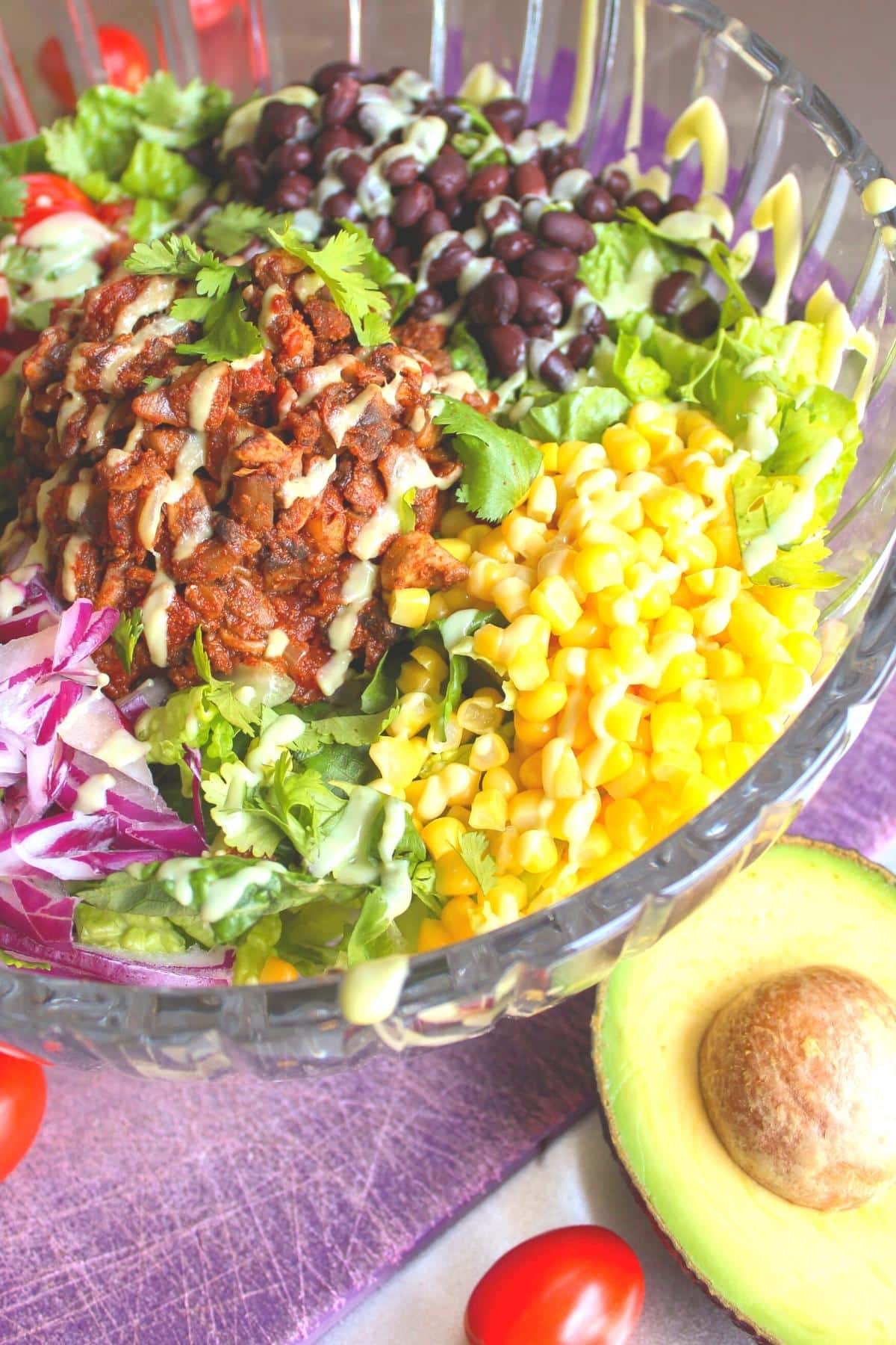 Vegan taco salad in a large glass serving bowl.