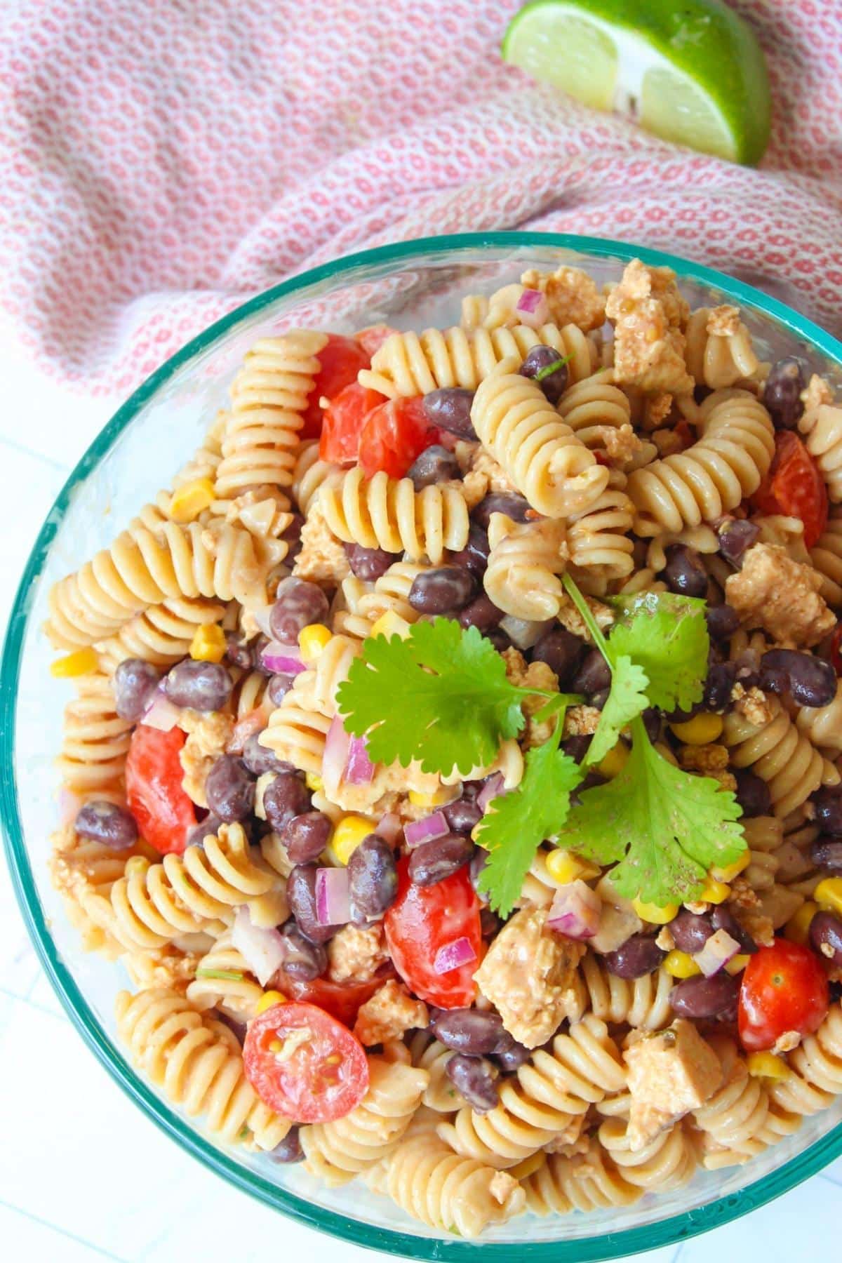 Vegan taco pasta salad in a glass serving bowl.