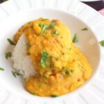 Instant pot creamy red lentil dal in a bowl over rice