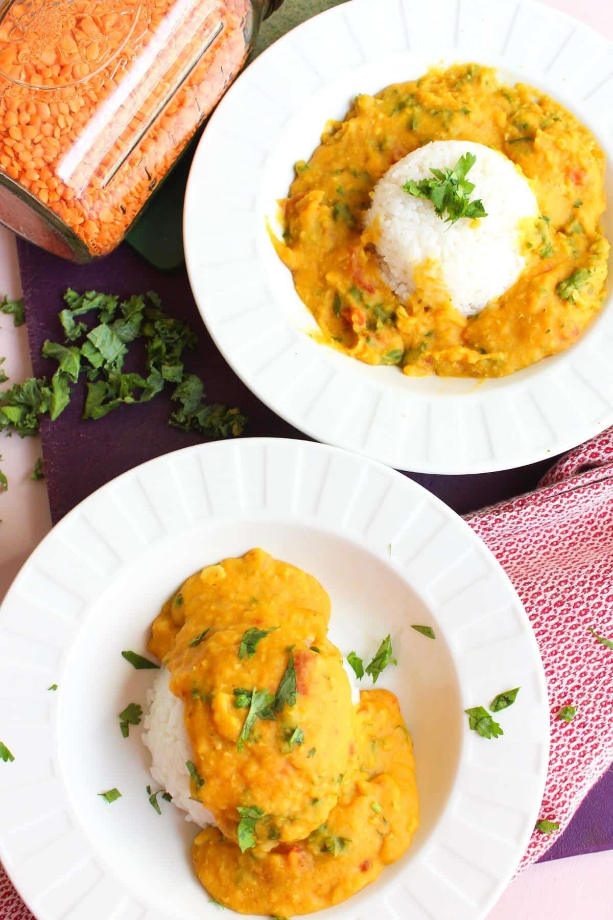 Instant pot red lentil dal in a bowl over rice.