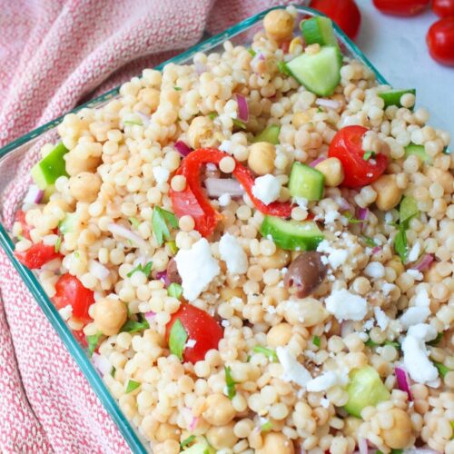 Israeli couscous salad in a serving dish.