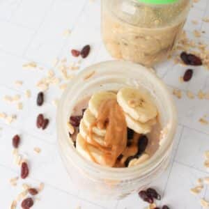 Overhead view of protein overnight oats in small glass mason jars.