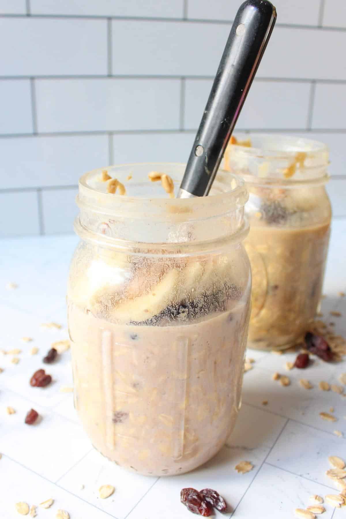Protein overnight oats ingredients in a glass mason jar.