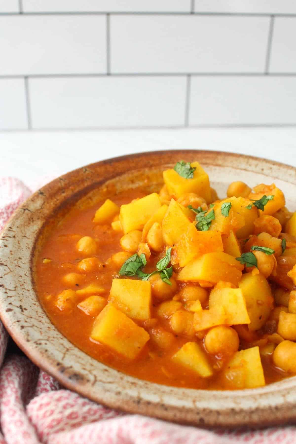 Chickpea and potato curry in a serving dish