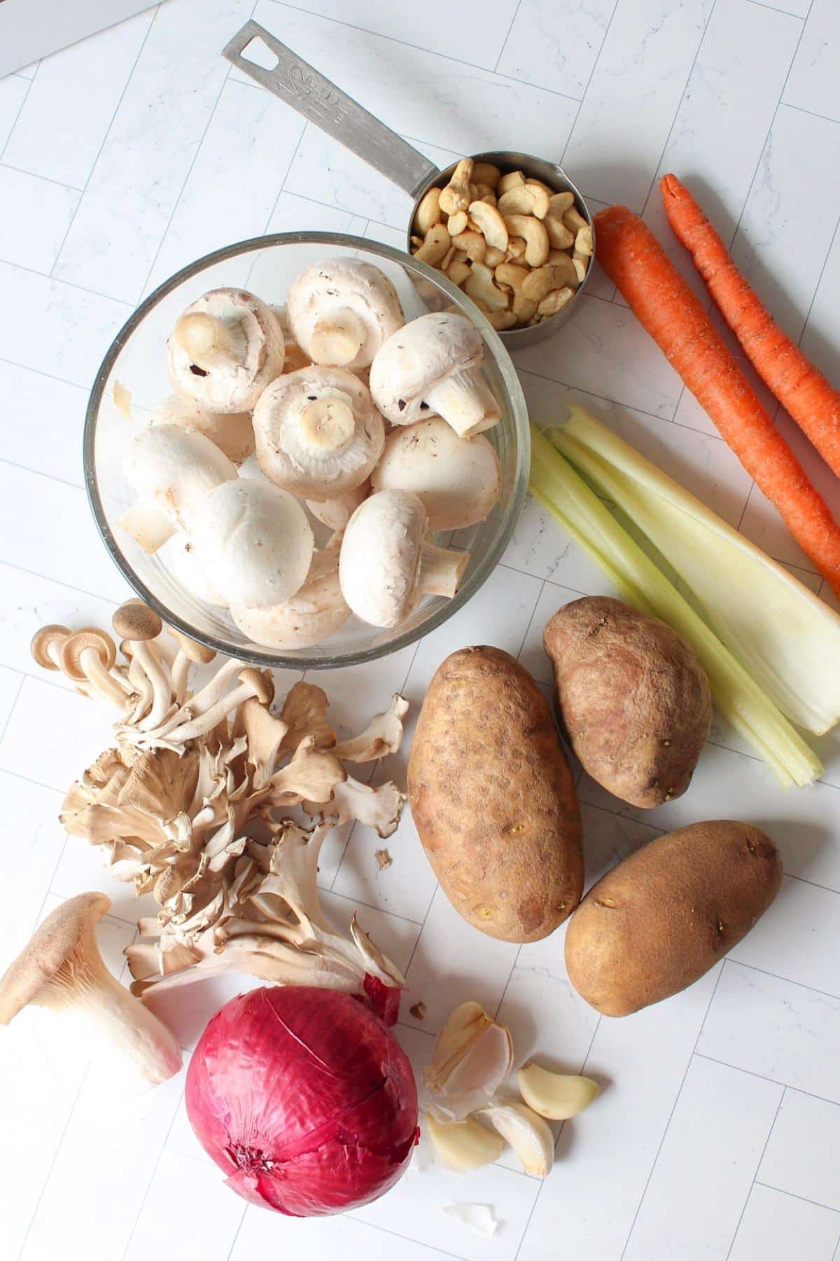 Vegan clam chowder ingredients laid out on a table