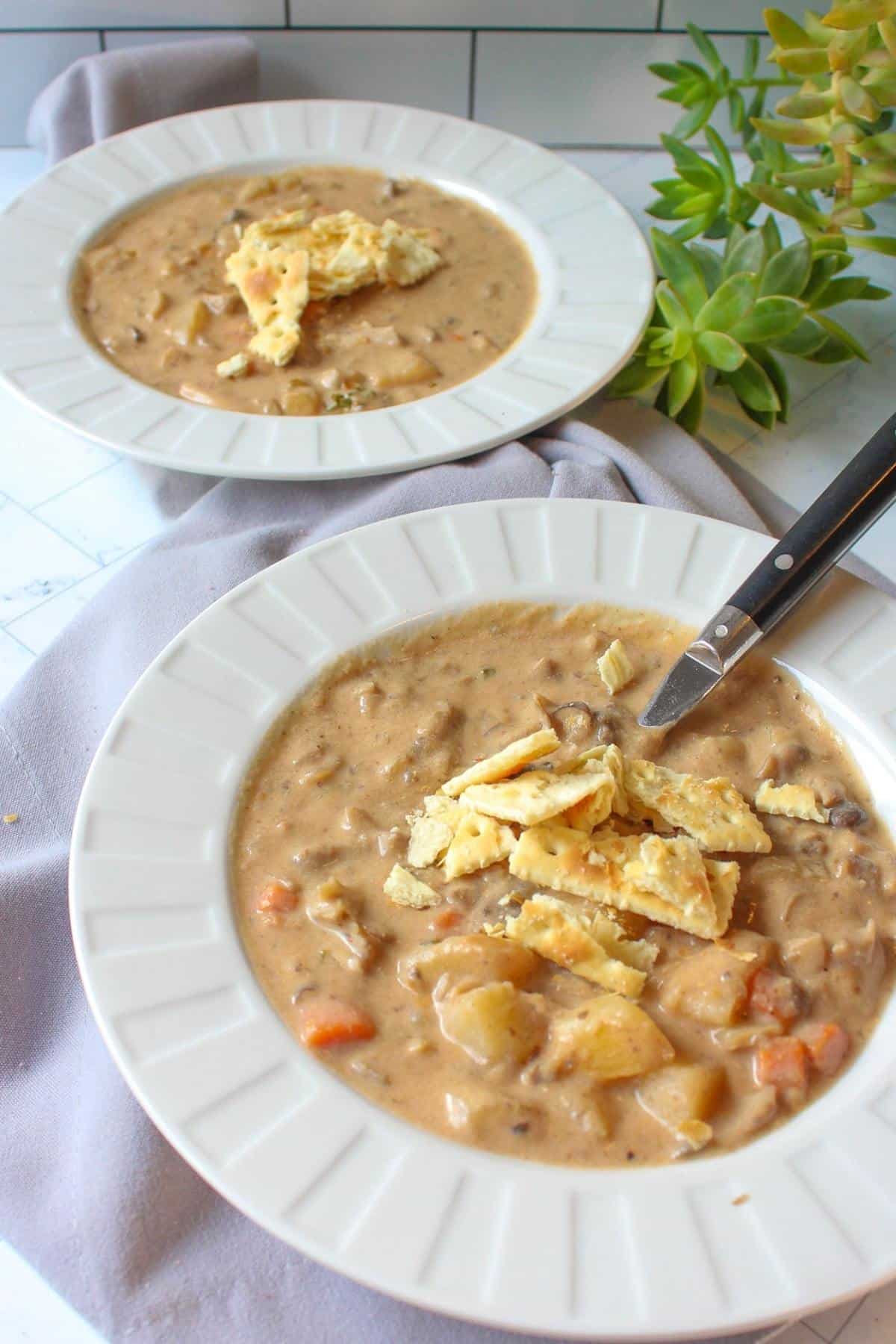 Vegan clam chowder in serving bowls.