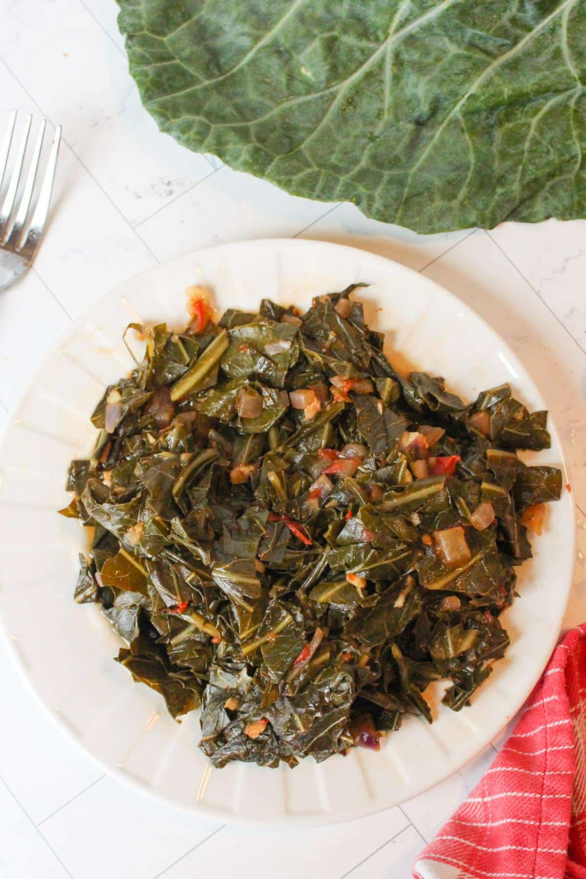 Overhead view of vegan collard greens on a plate.