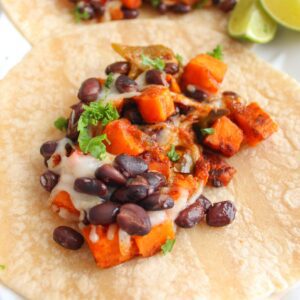 Vegan black bean sweet potato taco on a plate.