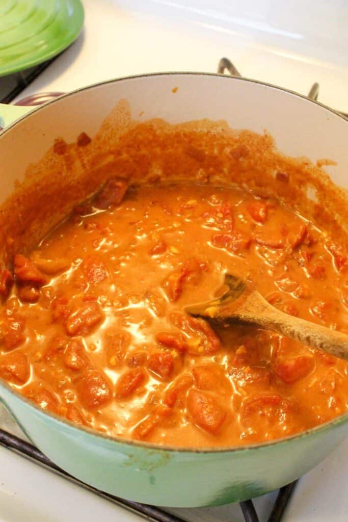 Tikka masala sauce in a dutch oven on the stove.
