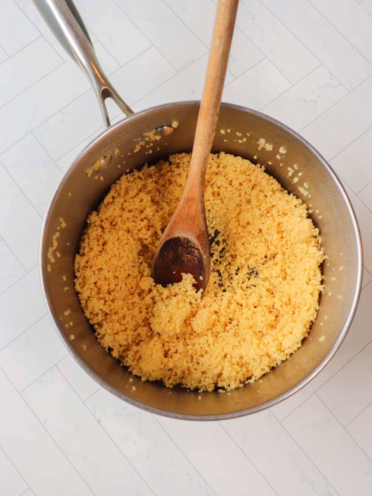 Couscous in a pan after being cooked.