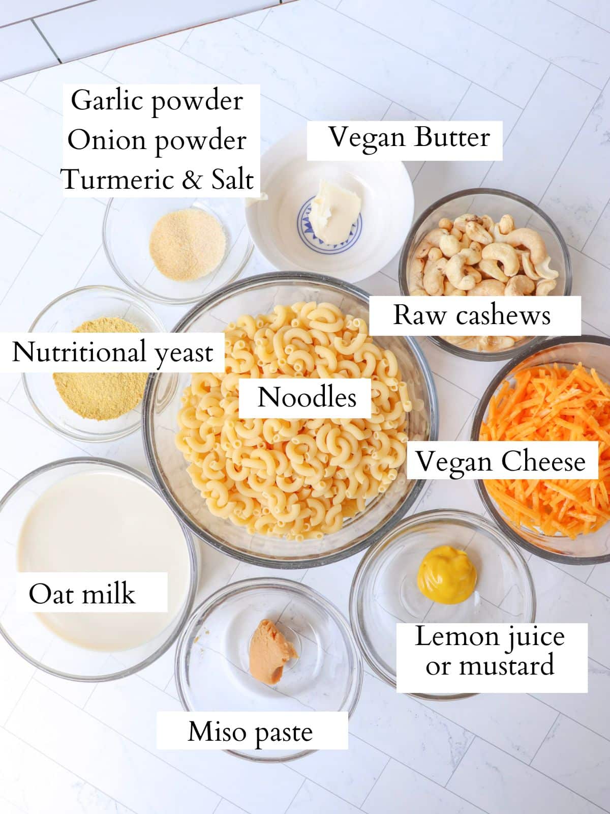 Ingredients for dairy free mac and cheese laid out on a kitchen counter.