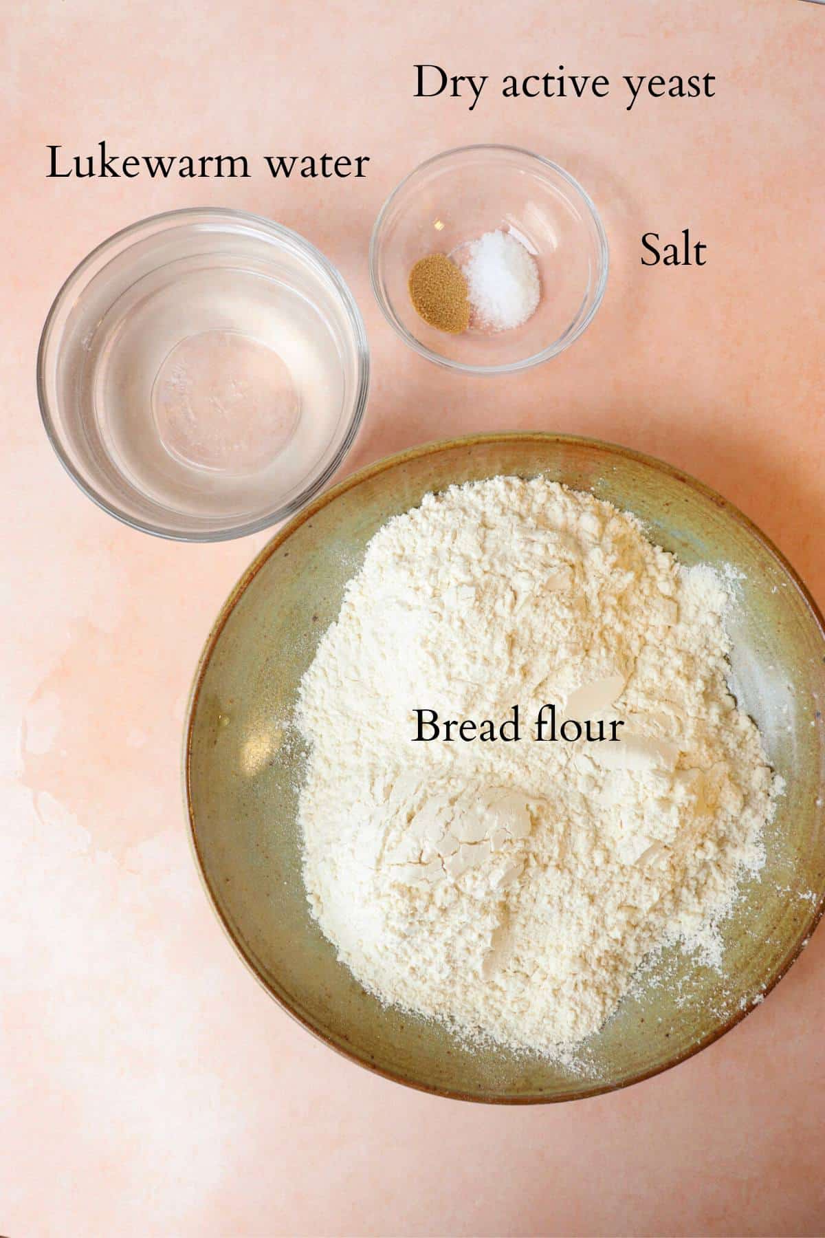 Ingredients for homemade bread laid out on a counter.