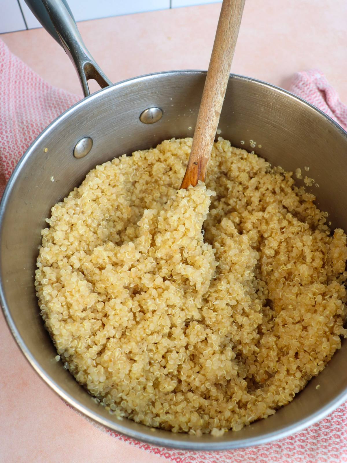 Fluffy quinoa in a pan after it's been cooked.